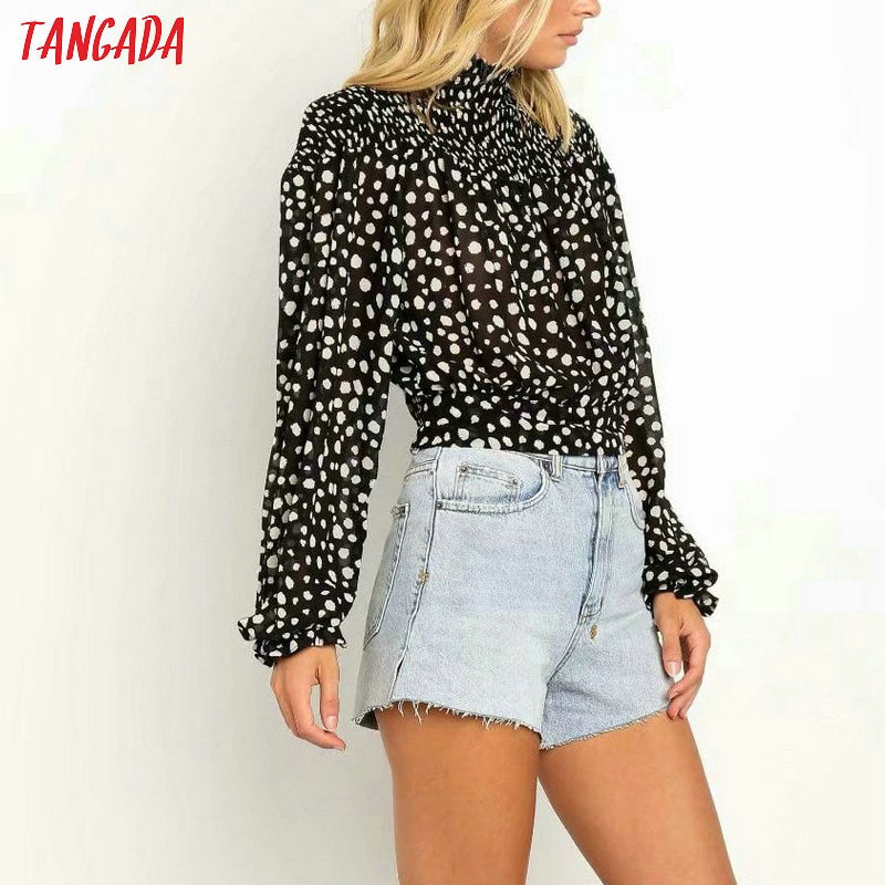 Camicetta dolcevita a pois bianca