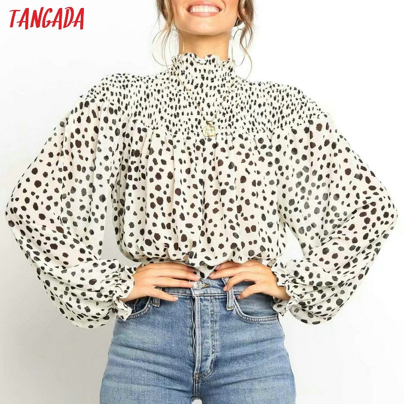 Camicetta dolcevita a pois bianca