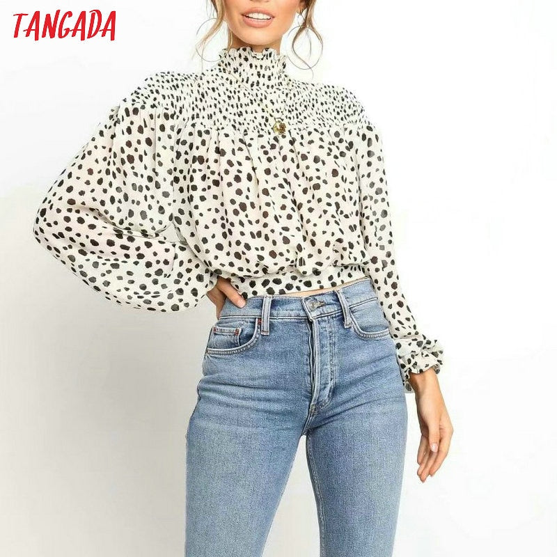 Camicetta dolcevita a pois bianca