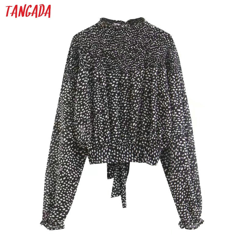 Camicetta dolcevita a pois bianca