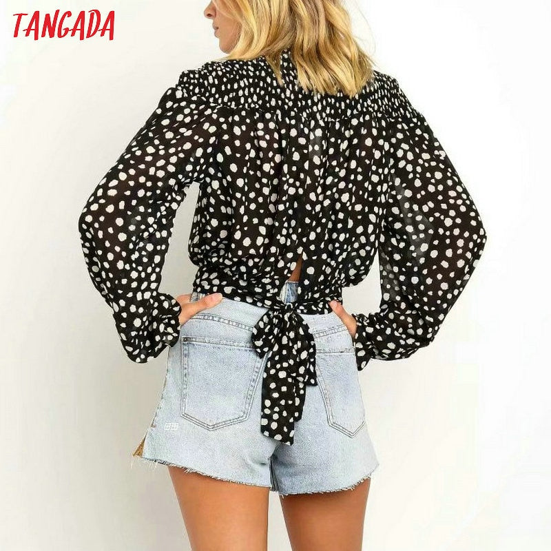 Camicetta dolcevita a pois bianca