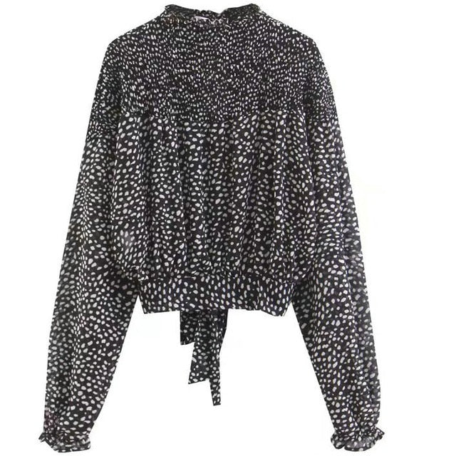 Camicetta dolcevita a pois bianca