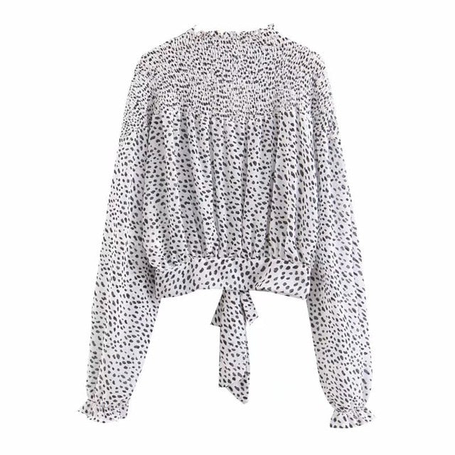 Camicetta dolcevita a pois bianca