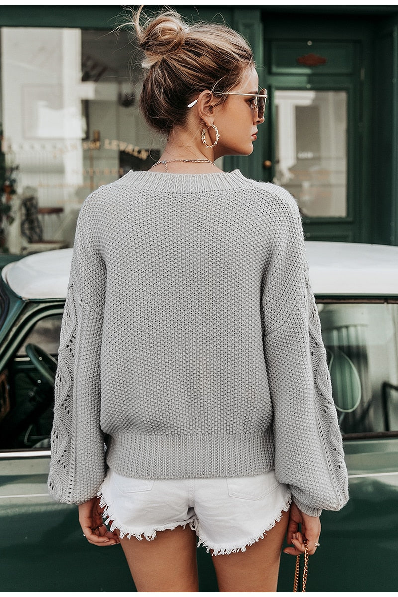 Maglione con disegno ricamato a rombi