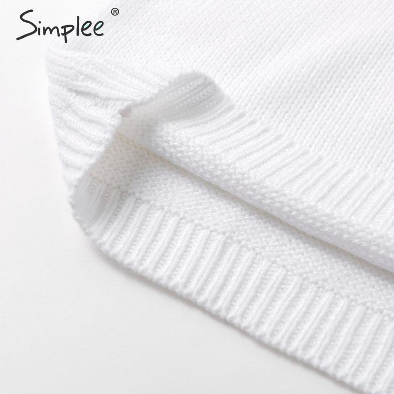 Vestito a collo alto con maniche bombate e disegno triangolare