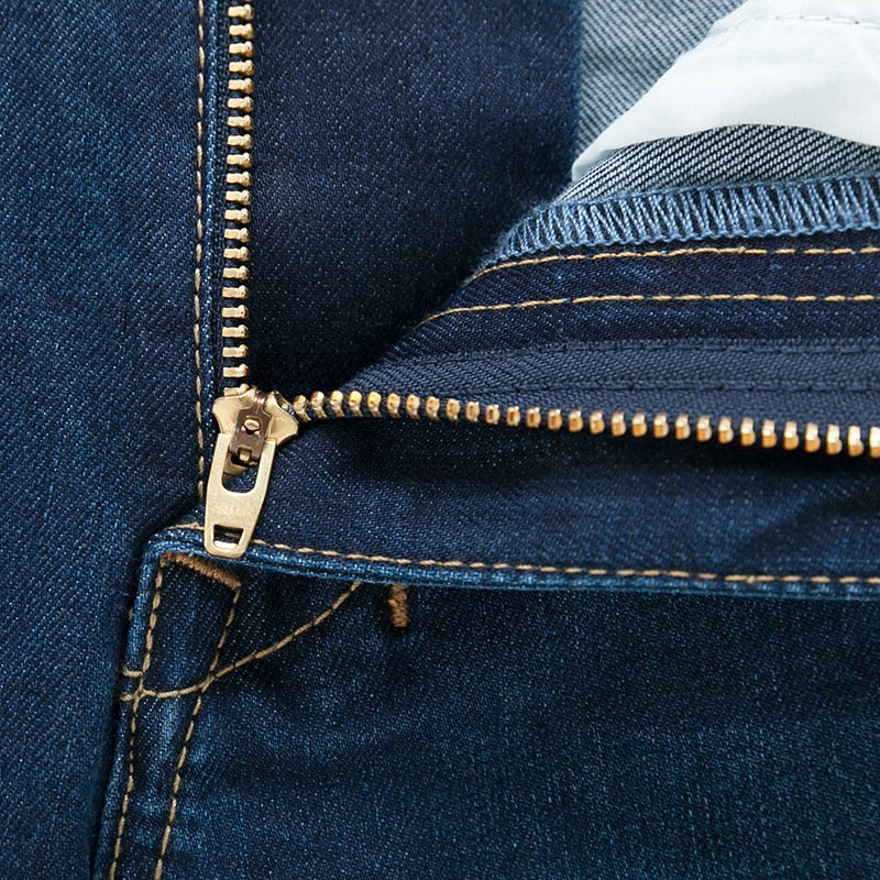 Jeans Slim Fit con risvoltino e chiusura a zip