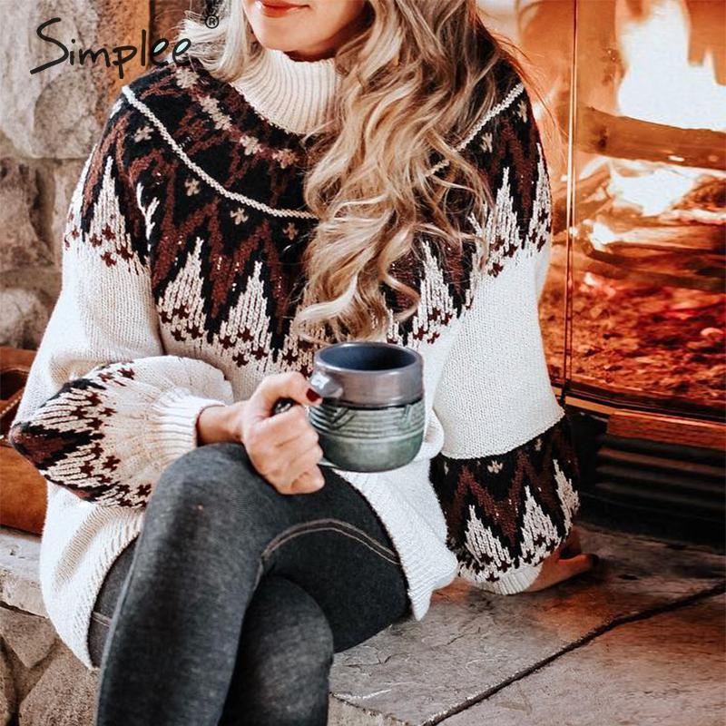 Vestito a collo alto con maniche bombate e disegno triangolare