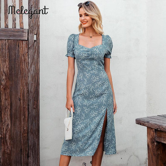 Abito con spacco alto a disegno floreale